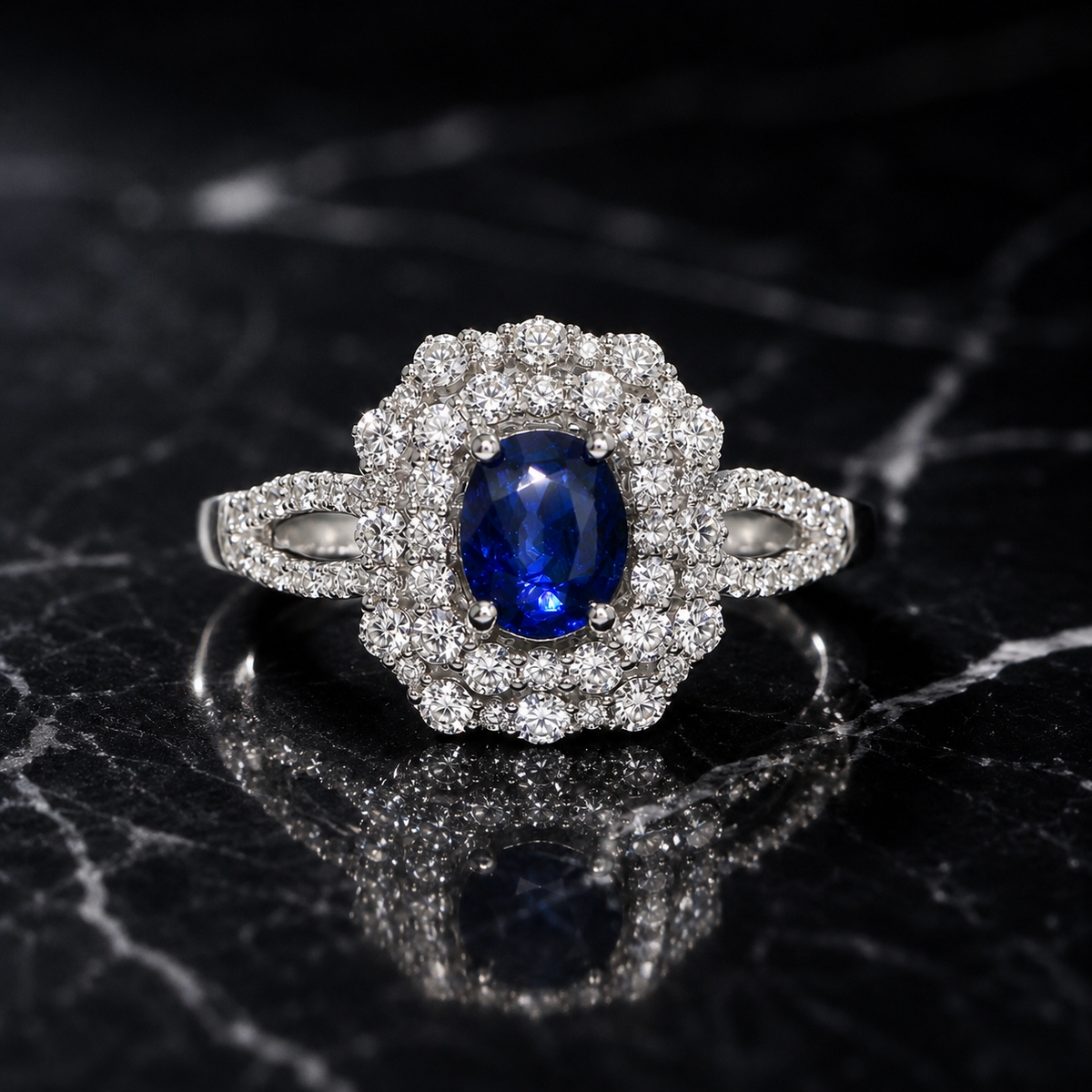 Kashmir Blue Sapphire and Diamond Double Halo Ring featuring Oval Cut Center and Split Shank Accents