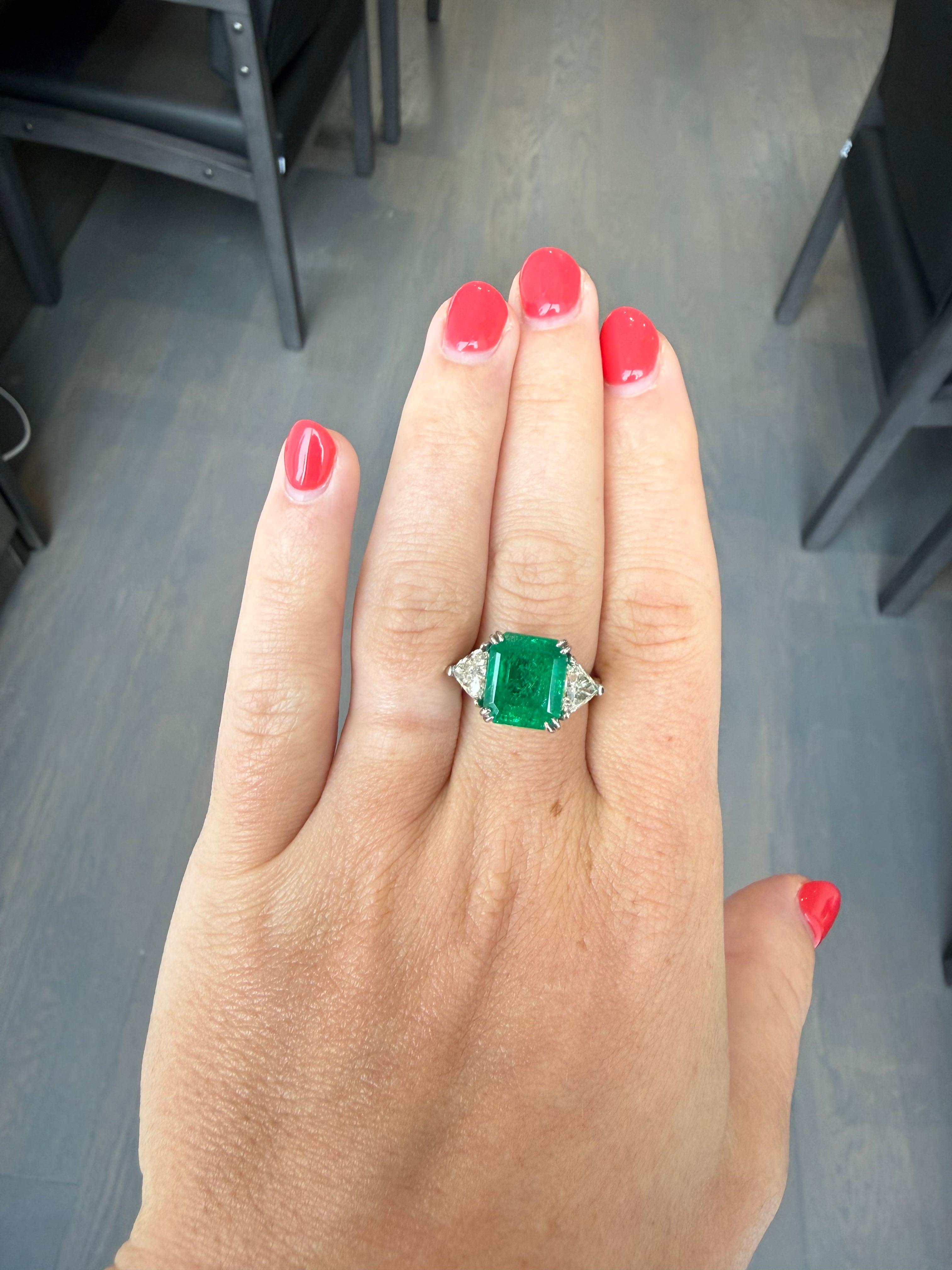 GIA Certified 4.77 Carat Colombian Emerald and 1.52 Carat Trilliant Diamond Platinum Three-Stone Ring